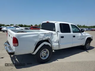 2000 Dodge Dakota Sport with VIN 1B7GG2AN8YS598547, listed as a Copart auction lot 54520985 with 244,605 mi miles and Salvage Title. Bid and sale history available at carsss.com. Image 3.