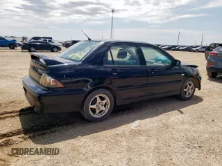 2002 Mitsubishi Lancer OZ-Rally z VIN JA3AJ86E32U001737, wystawiony jako Copart lot #59275695 z przebiegiem 177 332 mil mil oraz Szkoda całkowita • Salvage title. Historia ofert i sprzedaży dostępna na DreamBid. Obrazek 3.