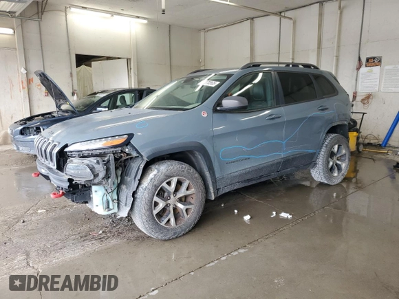 2014 Jeep Cherokee Trailhawk z VIN 1C4PJMBB0EW309277, wystawiony jako Copart lot #52370565 z przebiegiem 148 924 mil mil oraz Czysty tytuł • Clean title. Historia ofert i sprzedaży dostępna na DreamBid. Obrazek 1.