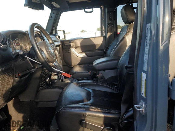 2015 Jeep Wrangler Unlimited Rubicon with VIN 1C4BJWFG7FL732694, listed as a Copart auction lot 42977435 with 128,759 mi miles and Salvage Title. Bid and sale history available at carsss.com. Image 7.