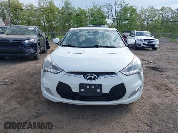 2012 Hyundai Veloster w/Gray Int z VIN KMHTC6AD6CU063301, wystawiony jako IAAI lot #42142593 z przebiegiem 100 796 mil mil oraz . Historia ofert i sprzedaży dostępna na DreamBid. Obrazek 6.