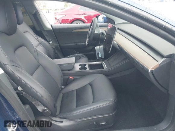 2023 Tesla Model 3 with VIN 5YJ3E1EA0PF518983, listed as a IAAI auction lot 41749225 with 26,748 mi miles and . Bid and sale history available at DreamBid. Image 5.