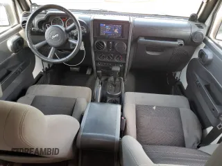 2010 Jeep Wrangler Unlimited Rubicon with VIN 1J4BA6H10AL176014, listed as a Copart auction lot 57092255 with 138,253 mi miles and Salvage title. Bid and sale history available at DreamBid. Image 8.