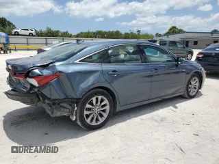 2021 Toyota Avalon Hybrid XLE z VIN 4T1AA1AB8MU007487, wystawiony jako Copart lot #57241445 z przebiegiem 63 154 mil mil oraz Nie do naprawy • Non repairable. Historia ofert i sprzedaży dostępna na DreamBid. Obrazek 3.