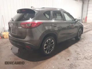 2016 Mazda CX-5 Grand Touring with VIN JM3KE4DY0G0732843, listed as a IAAI auction lot 41520889 with 149,798 mi miles. Bid and sale history available at carsss.com. Image 4.