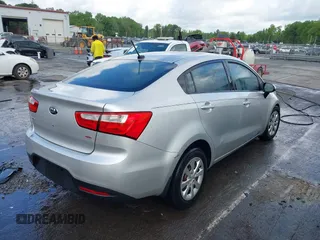 2014 Kia Rio LX with VIN KNADM4A31E6413780, listed as a IAAI auction lot 41996928 with 93,446 mi miles and . Bid and sale history available at DreamBid. Image 4.