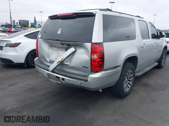 2010 Chevrolet Suburban LT with VIN 1GNUCJE03AR238548, listed as a IAAI auction lot 42104596 with 153,959 mi miles and . Bid and sale history available at DreamBid. Image 6.