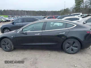2019 Tesla Model 3 Mid Range with VIN 5YJ3E1EA5KF297213, listed as a IAAI auction lot 41361412 with 93,801 mi miles and . Bid and sale history available at carsss.com. Image 14.