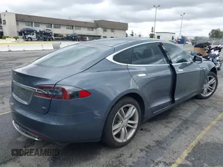 2013 Tesla Model S with VIN 5YJSA1CN8DFP21869, listed as a IAAI auction lot 41772603 with Not provided miles and . Bid and sale history available at DreamBid. Image 4.