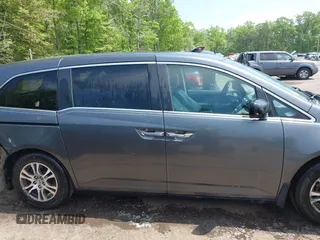 2012 Honda Odyssey EX-L with VIN 5FNRL5H67CB041252, listed as a IAAI auction lot 42158494 with 152,940 mi miles and . Bid and sale history available at DreamBid. Image 14.