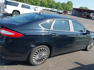 2016 Ford Fusion Titanium with VIN 3FA6P0K90GR333848, listed as a IAAI auction lot 42728138 with 147,864 mi miles and . Bid and sale history available at DreamBid. Image 13.