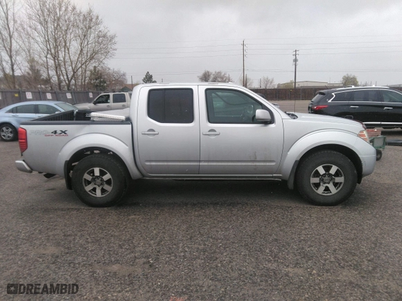 2011 Nissan Frontier PRO-4X with VIN 1N6AD0EV2BC438370, listed as a IAAI auction lot 41952484 with 217,529 mi miles. Bid and sale history available at carsss.com. Image 13.