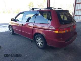2004 Honda Odyssey EX-L with VIN 5FNRL18994B048661, listed as a IAAI auction lot 41758209 with 295,737 mi miles and . Bid and sale history available at DreamBid. Image 3.