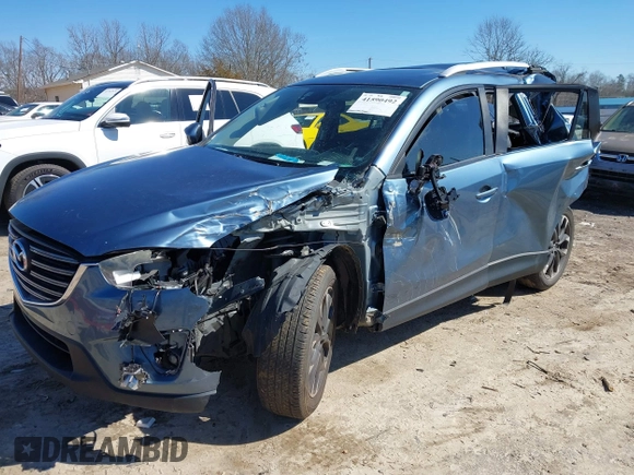 2016 Mazda CX-5 Grand Touring with VIN JM3KE2DY2G0715272, listed as a IAAI auction lot 41590492 with 134,176 mi miles. Bid and sale history available at carsss.com. Image 23.