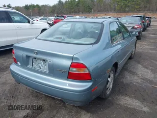 1995 Honda Accord EX w/Leather with VIN 1HGCD5665SA132230, listed as a IAAI auction lot 41955713 with 101,999 mi miles. Bid and sale history available at carsss.com. Image 4.