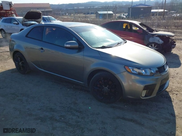 2010 Kia Forte Koup SX with VIN KNAFW6A38A5267375, listed as a IAAI auction lot 41699378 with 174,880 mi miles. Bid and sale history available at carsss.com. Image 1.