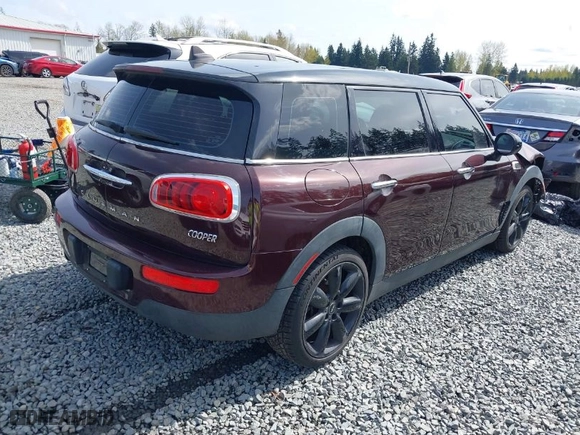 2016 MINI Cooper Clubman with VIN WMWLN5C57G2E30917, listed as a IAAI auction lot 41992494 with 38,567 mi miles. Bid and sale history available at carsss.com. Image 4.