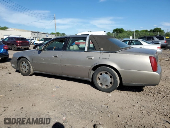 2001 Cadillac DeVille DHS z VIN 1G6KE57Y21U250470, wystawiony jako Copart lot #57334785 z przebiegiem 66 703 mil mil oraz Tytuł czysty. Historia ofert i sprzedaży dostępna na DreamBid. Obrazek 2.