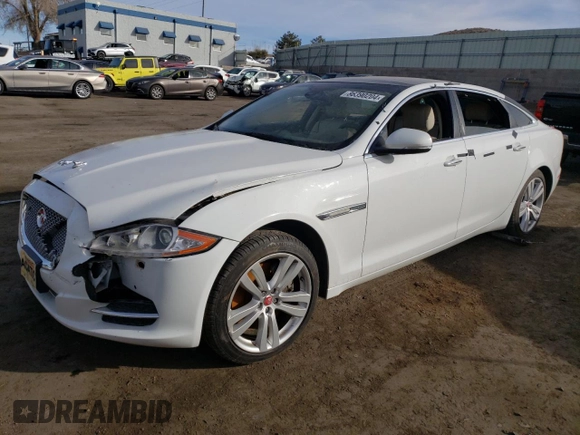2014 Jaguar XJ with VIN SAJWA2GZ7E8V69543, listed as a Copart auction lot 86390204 with 110,929 mi miles and Salvage Title. Bid and sale history available at carsss.com. Image 1.