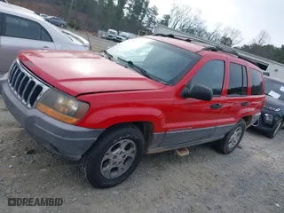 1999 Jeep Grand Cherokee Laredo with VIN 1J4GW58S0XC519908, listed as a IAAI auction lot 41789905 with 221,064 mi miles. Bid and sale history available at carsss.com. Image 15.