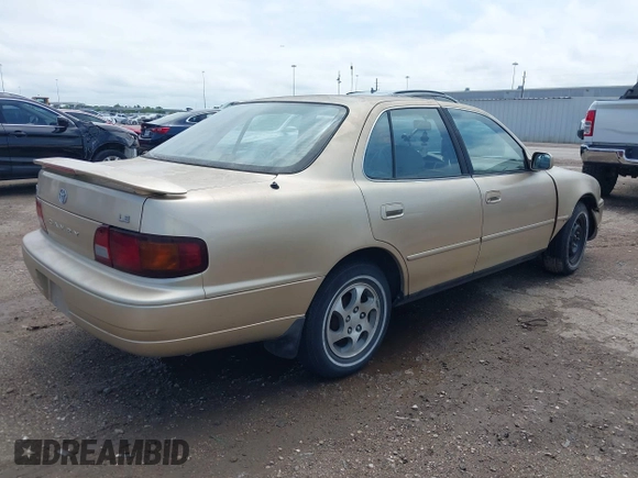 1996 Toyota Camry DX with VIN 4T1BG12K7TU781388, listed as a IAAI auction lot 42089118 with 196,988 mi miles. Bid and sale history available at carsss.com. Image 4.