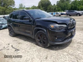 2019 Jeep Cherokee Latitude Plus with VIN 1C4PJMLB7KD101158, listed as a Copart auction lot 58246115 with 144,807 mi miles and Salvage title. Bid and sale history available at DreamBid. Image 4.