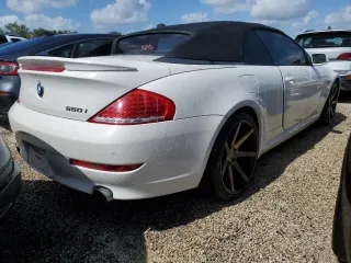 2009 BMW 6 Series 650i with VIN WBAEB53589CX64448, listed as a Copart auction lot 73867784 with 80,795 mi miles and Salvage Title. Bid and sale history available at carsss.com. Image 3.