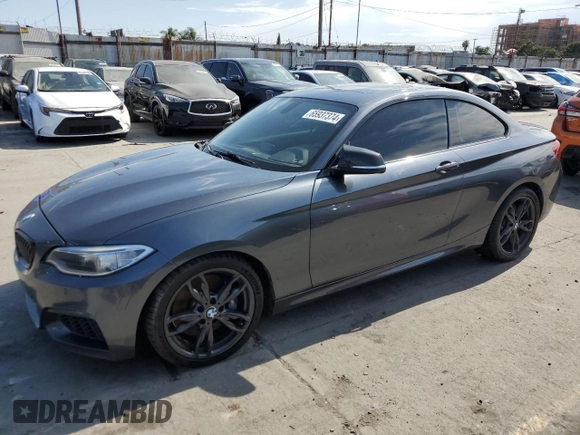 2016 BMW 2 Series M235i with VIN WBA1J7C52GV359958, listed as a Copart auction lot 65937374 with 82,231 mi miles and Salvage title. Bid and sale history available at DreamBid. Image 1.