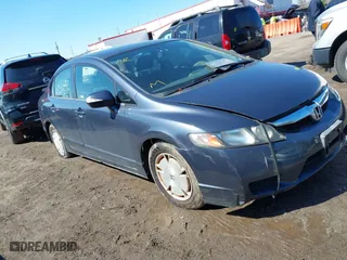 2010 Honda Civic Hybrid with VIN JHMFA3F21AS000966, listed as a IAAI auction lot 41880591 with 186,017 mi miles. Bid and sale history available at carsss.com. Image 1.