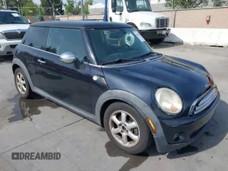 2009 MINI Cooper Hardtop with VIN WMWMF33589TW70400, listed as a IAAI auction lot 42055596 with 118,543 mi miles. Bid and sale history available at carsss.com. Image 1.