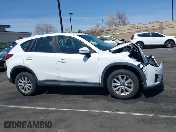 2016 Mazda CX-5 Sport with VIN JM3KE2BY9G0825285, listed as a IAAI auction lot 41841833 with 96,915 mi miles. Bid and sale history available at carsss.com. Image 13.