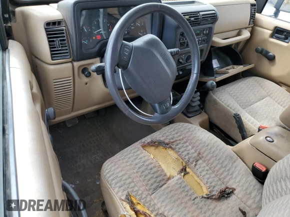 2000 Jeep Wrangler Sport z VIN 1J4FA49S9YP798353, wystawiony jako Copart lot #62009645 z przebiegiem 116 676 mil mil oraz Szkoda całkowita • Salvage title. Historia ofert i sprzedaży dostępna na DreamBid. Obrazek 8.