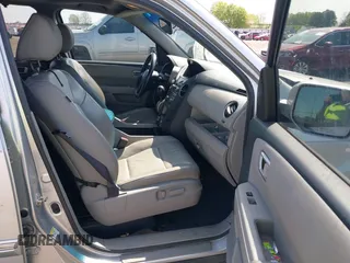 2013 Honda Pilot Touring with VIN 5FNYF3H95DB032438, listed as a IAAI auction lot 41865938 with 298,973 mi miles and . Bid and sale history available at DreamBid. Image 5.