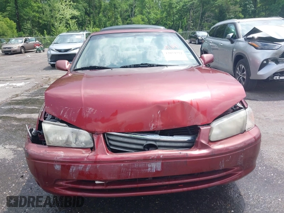 2000 Toyota Camry CE z VIN JT2BG22K3Y0521541, wystawiony jako IAAI lot #42074772 z przebiegiem 144 587 mil mil oraz . Historia ofert i sprzedaży dostępna na DreamBid. Obrazek 12.