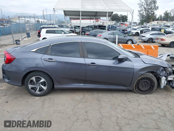 2020 Honda Civic LX with VIN 2HGFC2F64LH576765, listed as a IAAI auction lot 41881444 with 32,129 mi miles and . Bid and sale history available at DreamBid. Image 13.
