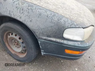 1994 Toyota Camry LE z VIN JT2GK12E1R0036423, wystawiony jako IAAI lot #41922375 z przebiegiem 211 529 mil mil oraz . Historia ofert i sprzedaży dostępna na DreamBid. Obrazek 6.