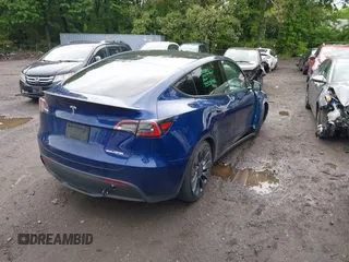 2024 Tesla Model Y Performance z VIN 7SAYGDEF1RA265382, wystawiony jako IAAI lot #42308468 z przebiegiem 9 700 mil mil oraz . Historia ofert i sprzedaży dostępna na DreamBid. Obrazek 4.
