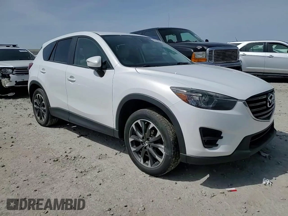 2016 Mazda CX-5 Grand Touring with VIN JM3KE4DY3G0688286, listed as a Copart auction lot 52182205 with 194,352 mi miles and Salvage Title. Bid and sale history available at DreamBid. Image 14.