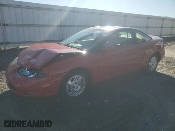 2001 Saturn SC z VIN 1G8ZY12751Z284992, wystawiony jako Copart lot #87116694 z przebiegiem 134 690 mil mil oraz Tytuł czysty. Historia ofert i sprzedaży dostępna na DreamBid. Obrazek 1.