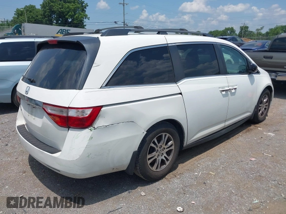 2012 Honda Odyssey EX-L with VIN 5FNRL5H63CB063684, listed as a IAAI auction lot 42576742 with 170,656 mi miles and . Bid and sale history available at DreamBid. Image 6.