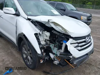 2014 Hyundai Santa Fe z VIN 5XYZUDLB9EG227009, wystawiony jako IAAI lot #42272191 z przebiegiem 97 474 mil mil oraz . Historia ofert i sprzedaży dostępna na DreamBid. Obrazek 6.