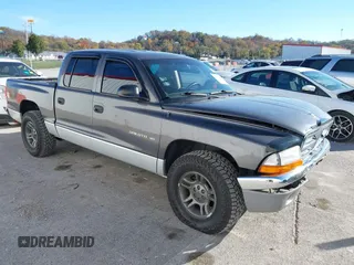 2001 Dodge Dakota Sport with VIN 1B7HL2AN21S319390, listed as a IAAI auction lot 40836729 with 118,823 mi miles. Bid and sale history available at carsss.com. Image 1.