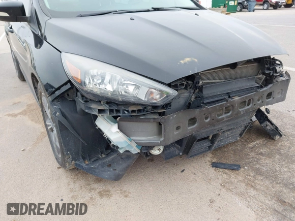 2017 Ford Focus SE with VIN 1FADP3FE4HL307110, listed as a IAAI auction lot 41992037 with 54,380 mi miles and . Bid and sale history available at DreamBid. Image 14.