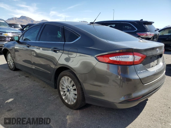 2016 Ford Fusion SE Hybrid with VIN 3FA6P0LU3GR307666, listed as a Copart auction lot 57444365 with 127,786 mi miles and Salvage title. Bid and sale history available at DreamBid. Image 2.