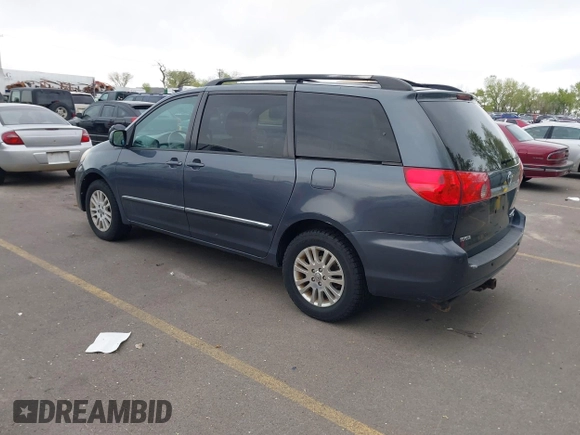 2009 Toyota Sienna XLE with VIN 5TDBK22C19S027059, listed as a IAAI auction lot 42105532 with 241,532 mi miles. Bid and sale history available at carsss.com. Image 3.