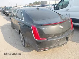2019 Cadillac XTS Luxury with VIN 2G61M5S38K9100792, listed as a IAAI auction lot 41676187 with 103,056 mi miles and . Bid and sale history available at DreamBid. Image 3.