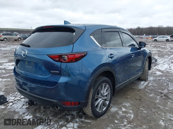 2020 Mazda CX-5 Grand Touring with VIN JM3KFBDM2L0778831, listed as a IAAI auction lot 41739655 with 72,533 mi miles. Bid and sale history available at carsss.com. Image 4.