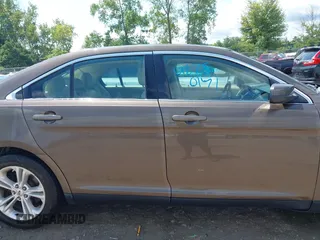 2015 Ford Taurus SEL with VIN 1FAHP2E82FG201994, listed as a IAAI auction lot 42750171 with 228,873 mi miles and . Bid and sale history available at DreamBid. Image 13.