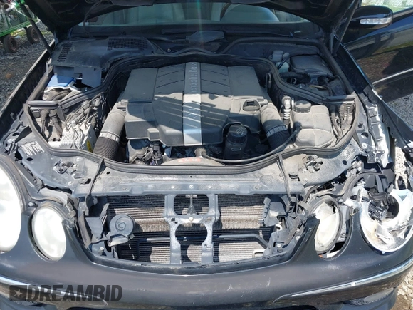 2005 Mercedes-Benz E-Class 3.2L with VIN WDBUF65J05A634879, listed as a IAAI auction lot 39904592 with 4,835 mi miles. Bid and sale history available at carsss.com. Image 10.