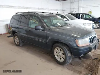 2001 Jeep Grand Cherokee Laredo with VIN 1J4GW48S91C525711, listed as a IAAI auction lot 42048952 with 1 mi miles. Bid and sale history available at carsss.com. Image 1.